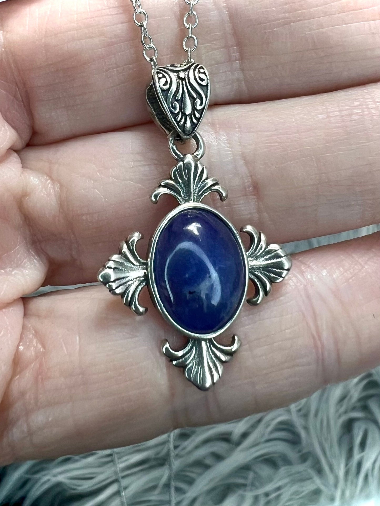 Tanzanite cross pendant in silver